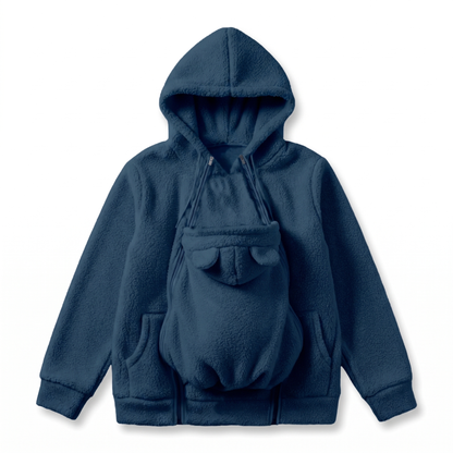 Parent wearing the fleece baby carrier hoodie with baby secured in the zip-in kangaroo pouch