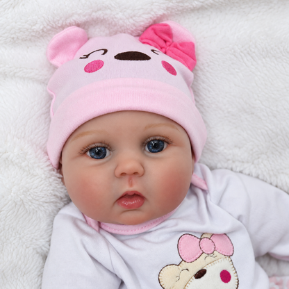 Realistic reborn newborn baby doll, 18 inch, side view in outfit