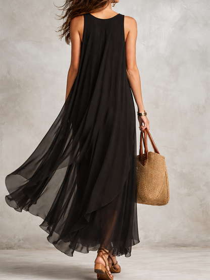 Black layered chiffon maxi dress by Christine Brewer featuring bohemian style and flowing fabric, perfect for elegant summer occasions.
