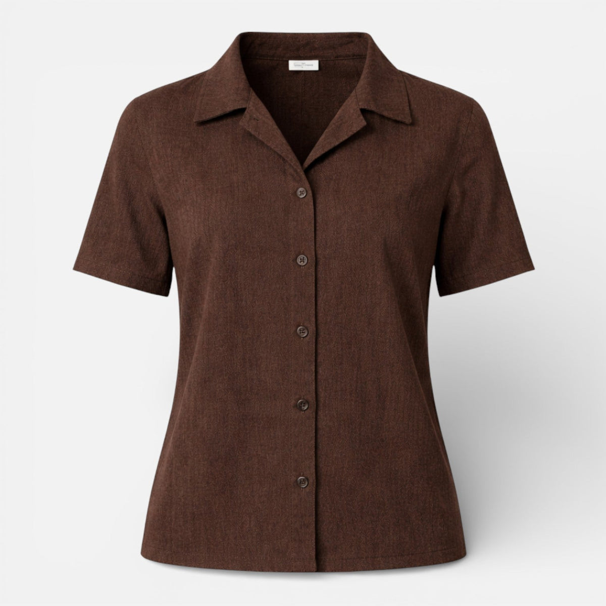 Women's short sleeve button-up shirt by Christine Brewer, featuring a classic fit and clean design, shown in a close-up view.
