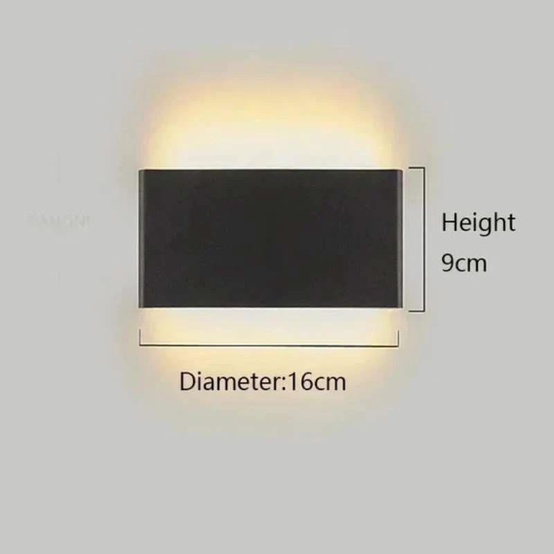 Minimalist aluminium LED wall light; black finish with upward and downward glow on a bedroom wall.