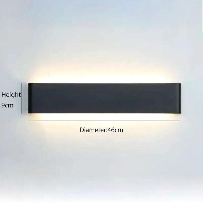 Wall Light LYST minimalist dark grey aluminium LED wall light with up and down lighting mounted on bedroom wall