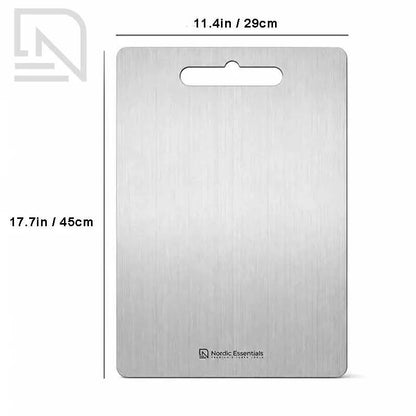 Premium Stainless Steel Chopping Board used for food prep in a kitchen; double-sided, anti-bacterial, knife-safe, silver finish, Nordic Essentials branding visible.