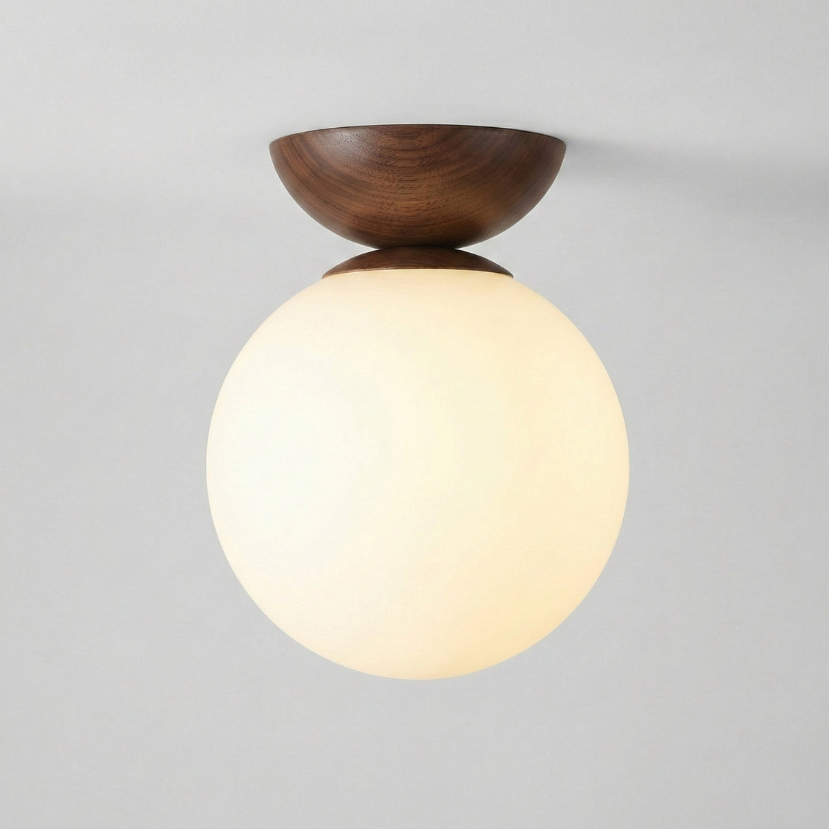 round japandi globe ceiling light in walnut