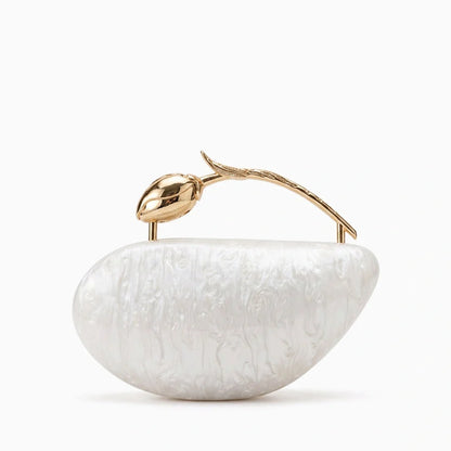 Clear acrylic clutch bag with a geometric design, featuring gold tone clasp and chain strap, front view