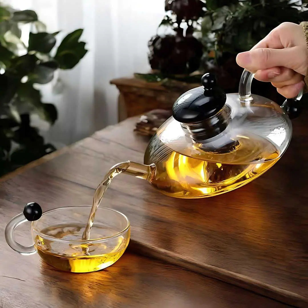 glass teapot set with cups in transparent