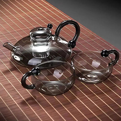 glass teapot set with cups in gray