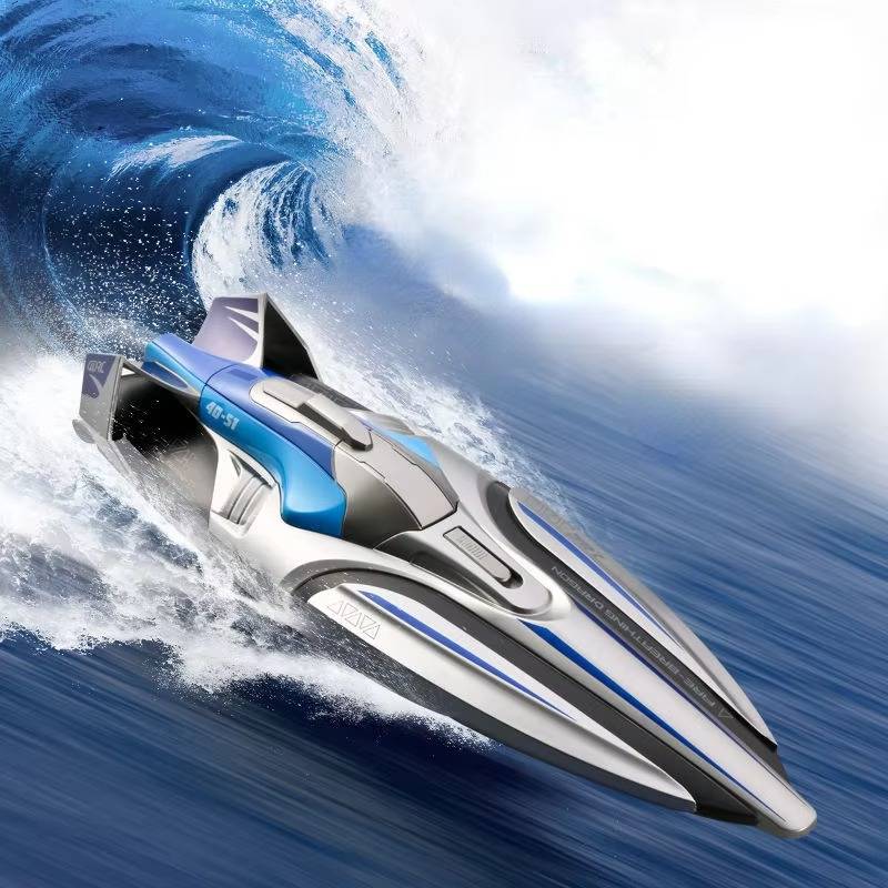 Silver RC racing boat cutting through a wave, action shot