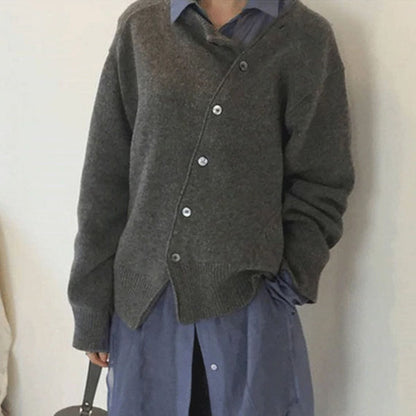 Loïs asymmetrisch knoop vest in grijze kleurvariant met tas