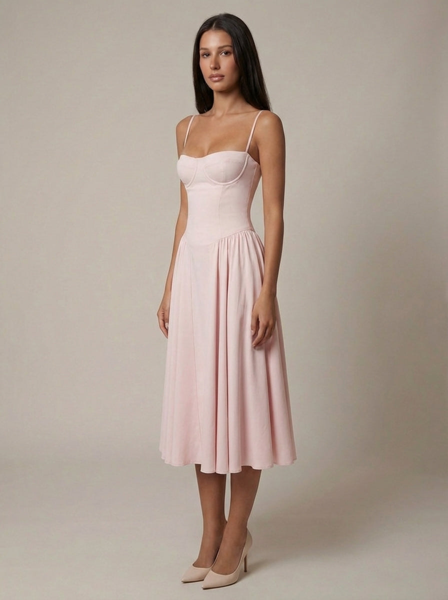 Light pink corset midi dress with thin straps and flowing pleated skirt