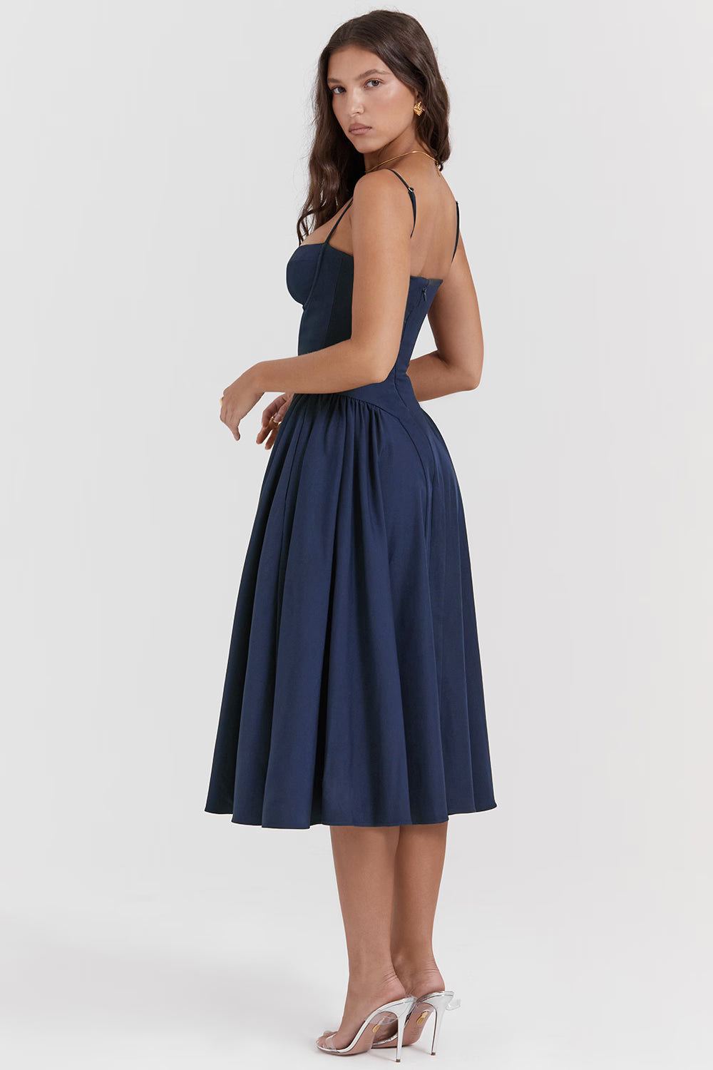 Back view of navy corset midi dress with thin straps