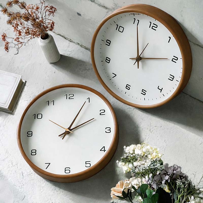 Nordic Wooden Wall Clock - Minimalist Silent Timepiece two brown-framed clocks on light grey wall with nearby decor.
